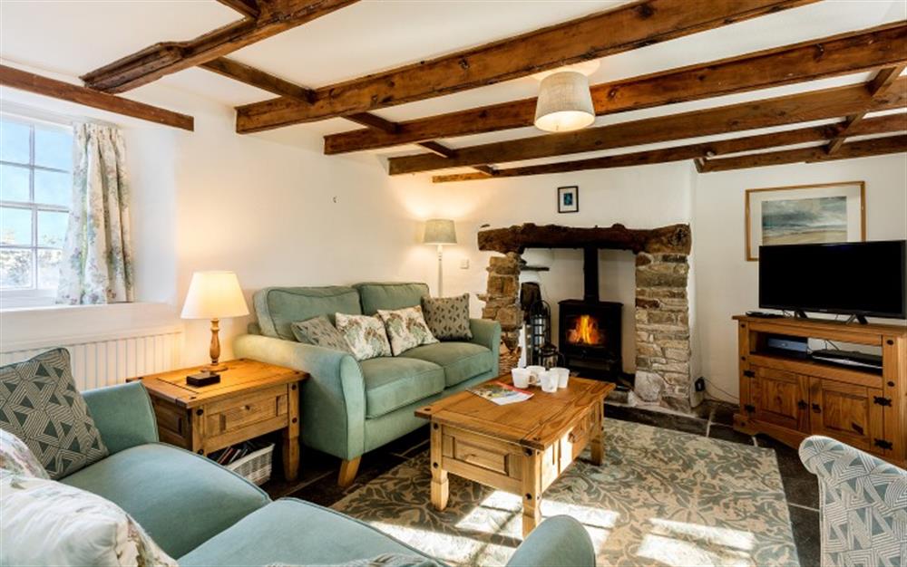 The pretty and cosy lounge at Cocks Cottage in St Teath