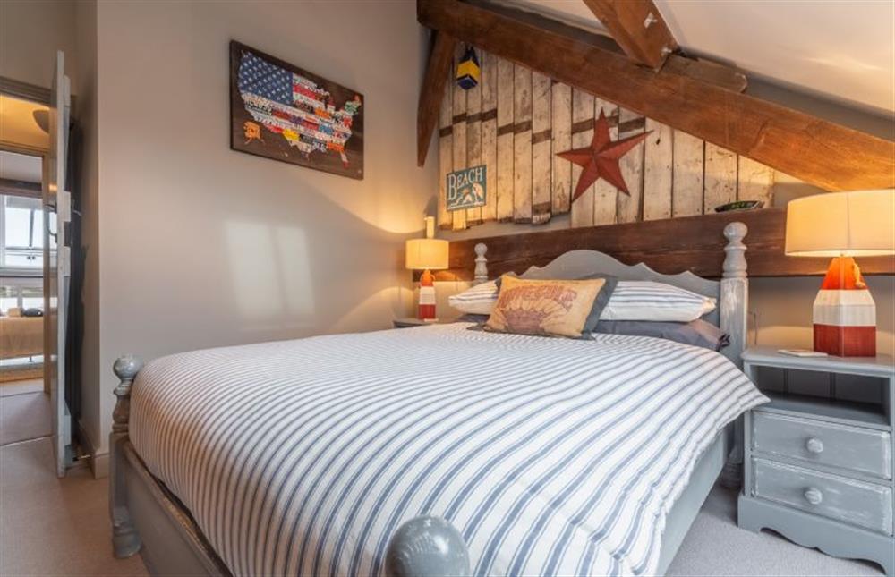 First floor: Bedroom two with double bed (photo 3) at Cog Cottage, Great Walsingham