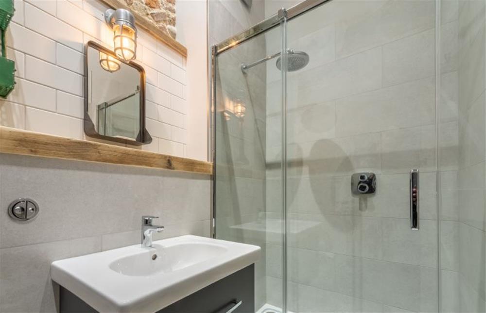 First floor: Family bathroom with large walk-in shower, WC and wash basin at Cog Cottage, Great Walsingham