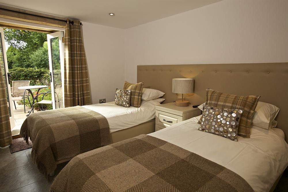 Twin bedroom with French doors to front terrace at Cola's Tonne in , Salcombe