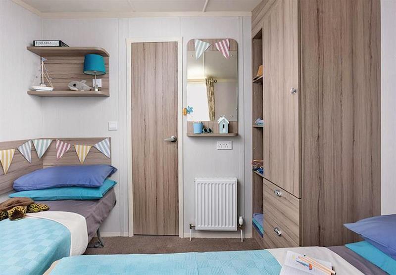 Twin bedroom in a Deluxe Caravan 2 at Coldingham Bay Leisure Park in Coldingham, Berwickshire