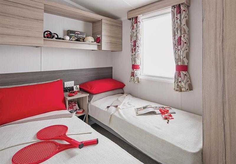 Twin bedroom in a Superior Caravan 2 at Coldingham Bay Leisure Park in Coldingham, Berwickshire