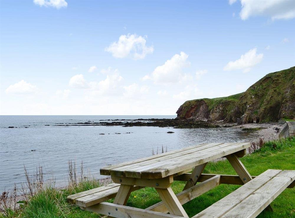 Seating area with sea views at Coldwrait Cottage in Burnmouth, near Berwick-upon-Tweed, Berwickshire