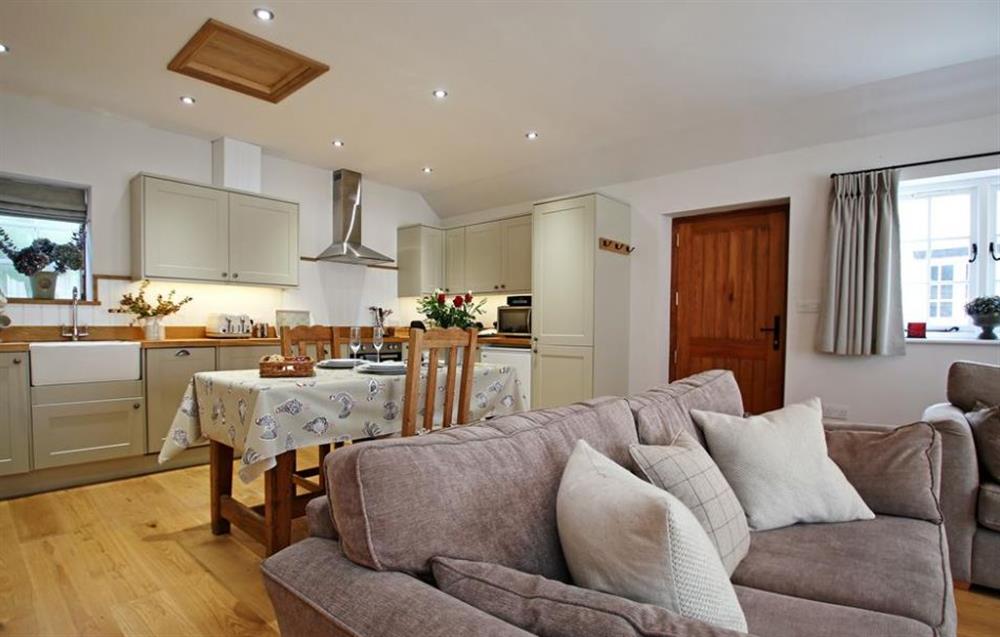 The kitchen and living room at College Farmhouse Cottage, Nr Stow-on-the-Wold, Oxfordshire