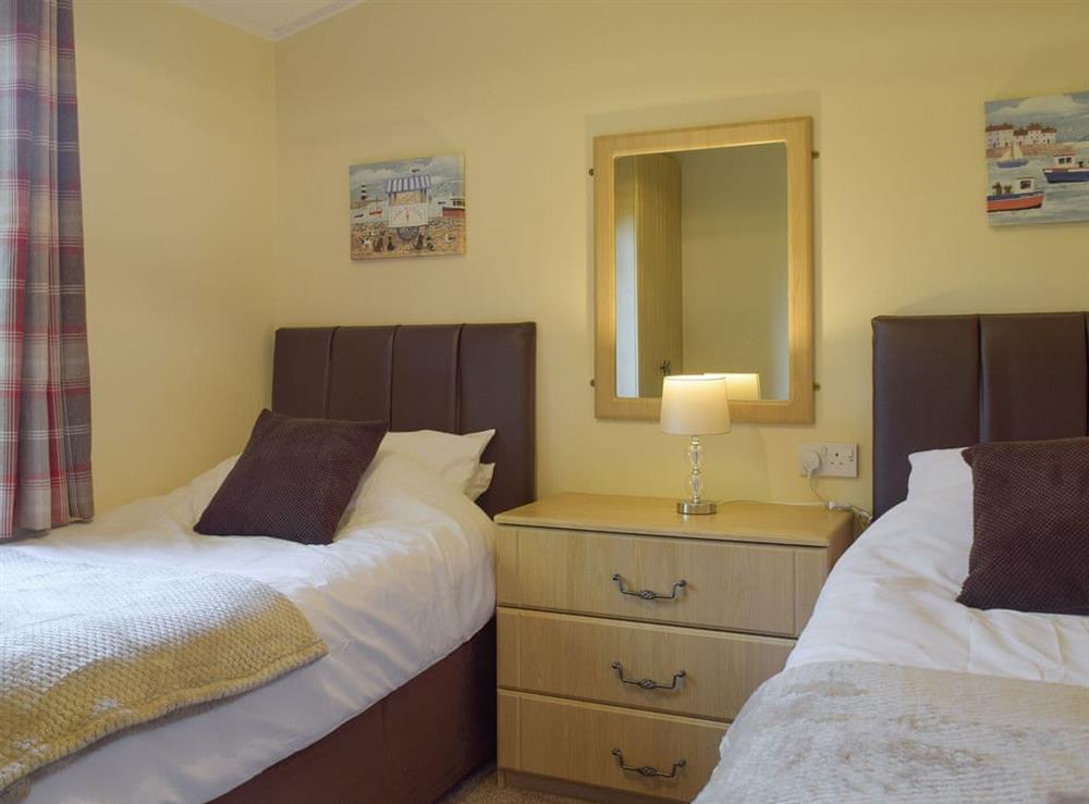 Comfortable twin bedroom at Colman Brook Lodge in Corton, near Lowestoft, Suffolk
