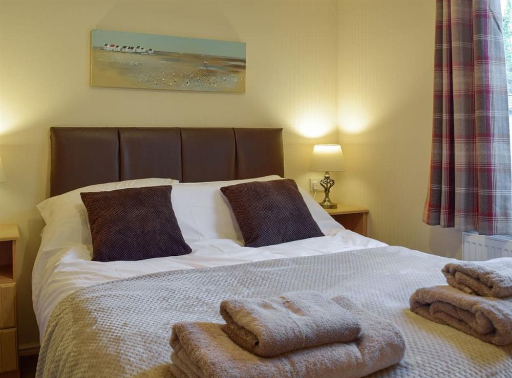 Relaxing en-suite double bedroom at Colman Brook Lodge in Corton, near Lowestoft, Suffolk