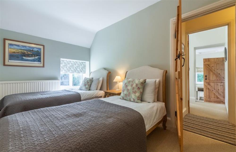 First floor: Bedroom two has full size twin beds at Columbine Cottage, Holme-next-the-Sea near Hunstanton