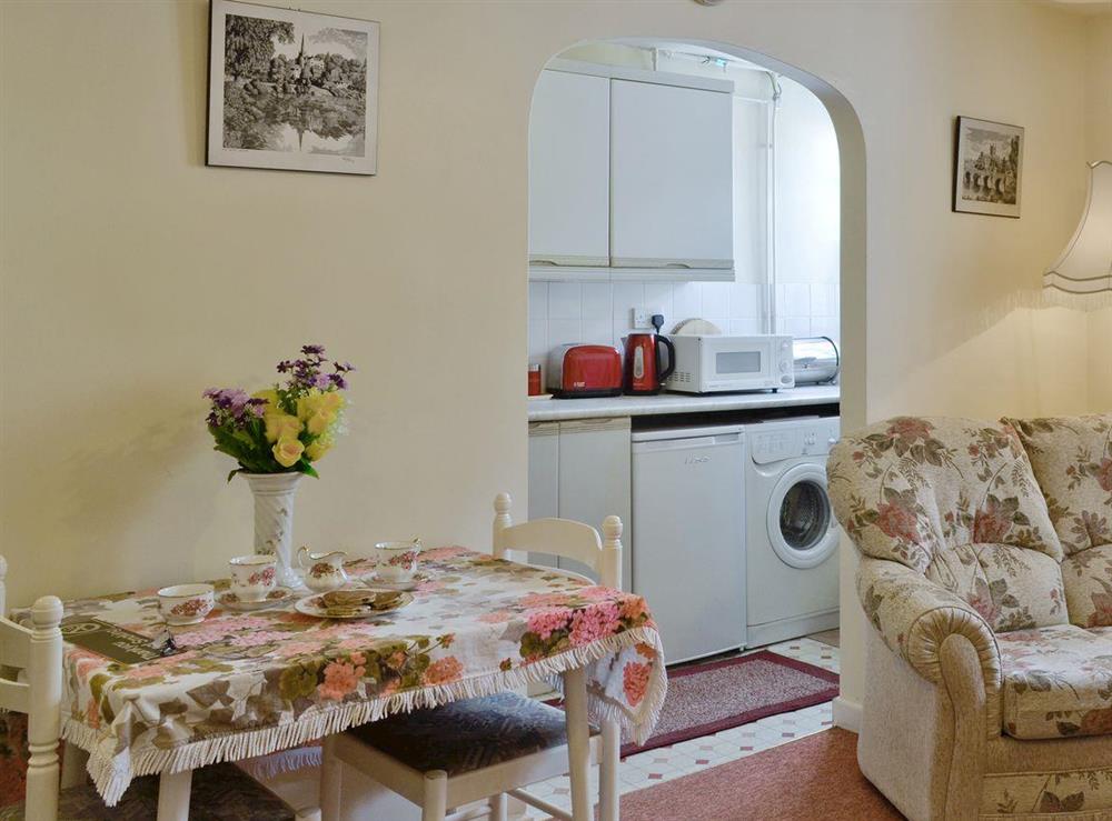 Intimate dining area with convenient access to kitchen at Columbine Cottage in Ross-on-Wye, Herefordshire