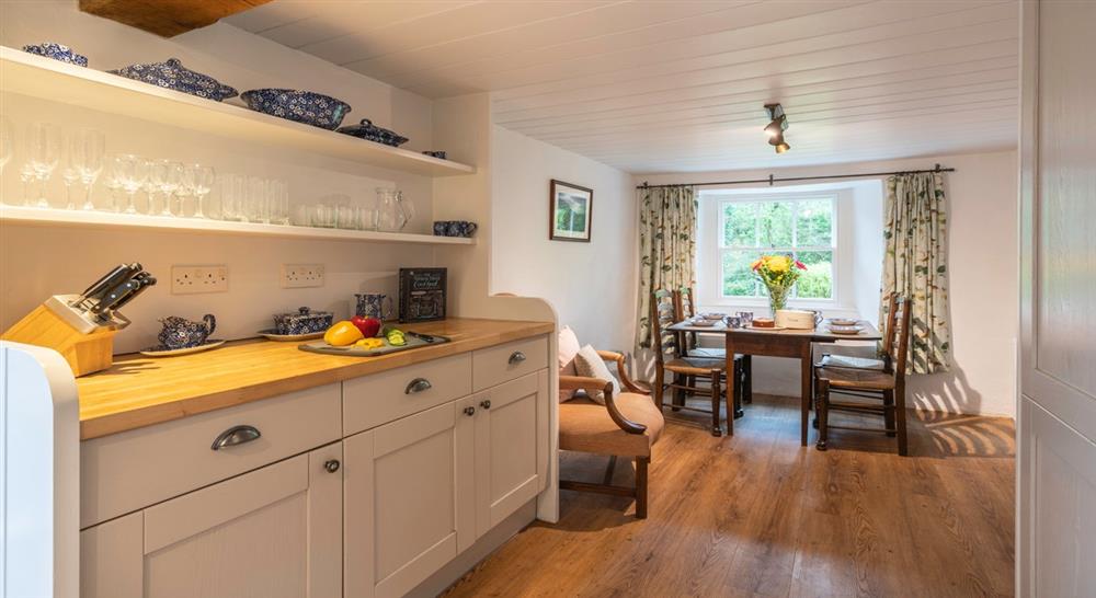 The bright, airy kitchen dining area at Combe Cottage in Nr. Bideford, Devon