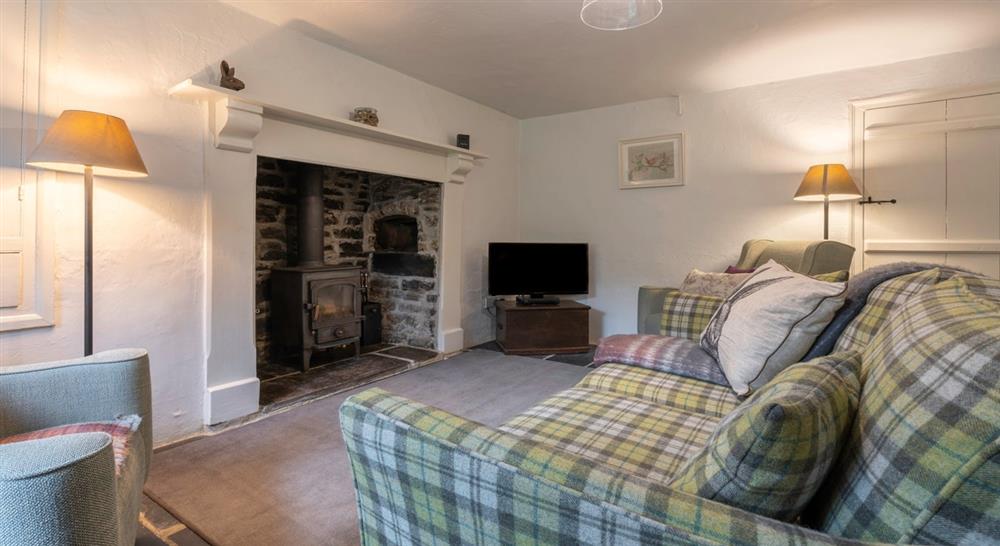 The cosy sitting room at Combe Cottage in Nr. Bideford, Devon