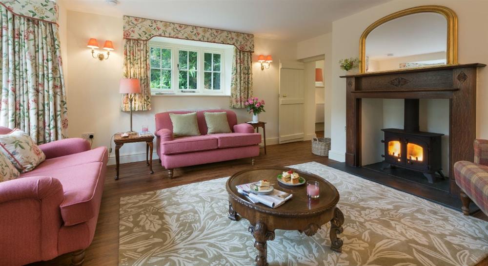 The cosy sitting room at Combe Park Lodge in Lynton, Devon