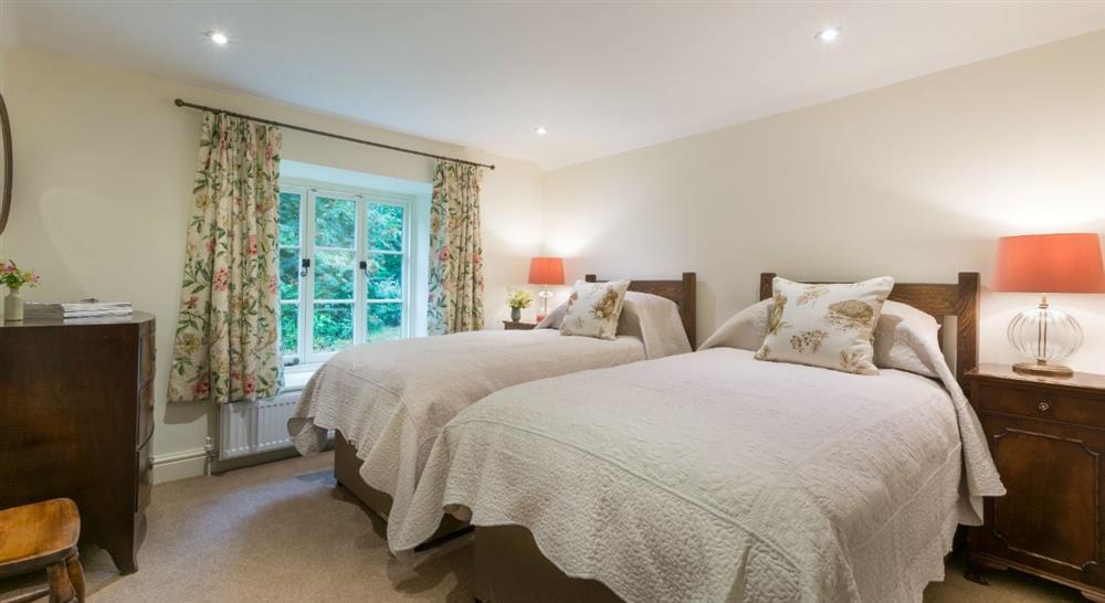 The spacious twin bedroom at Combe Park Lodge in Lynton, Devon