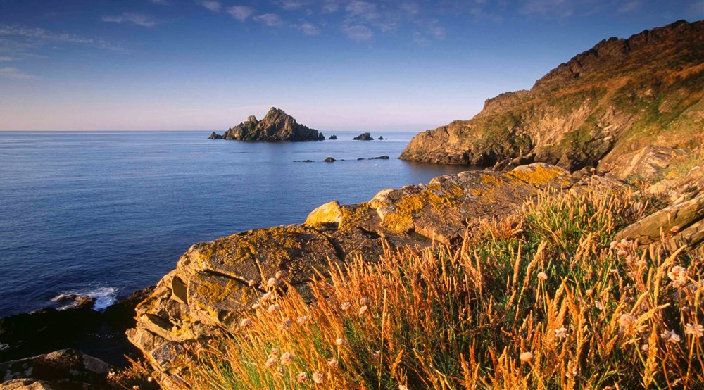 A view of the rugged coastline at Compass Cottage in Dartmouth, Devon