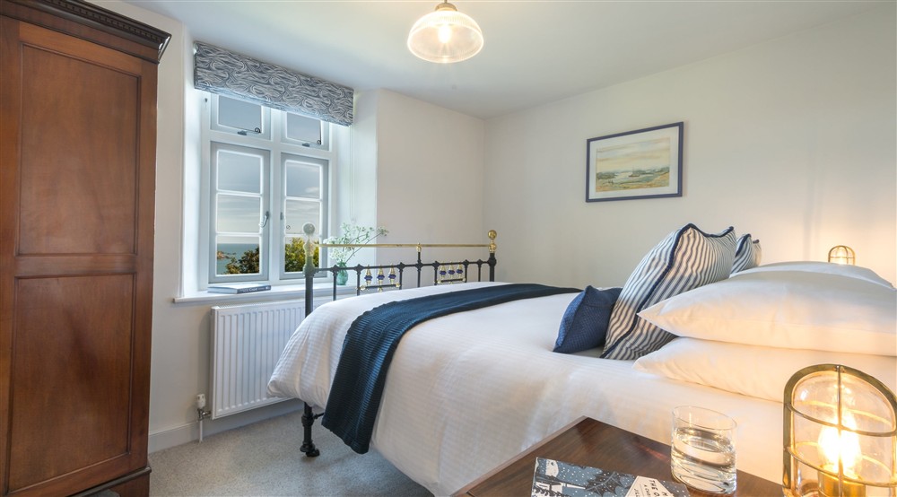 The first-floor double bedroom (photo 2) at Compass Cottage in Dartmouth, Devon