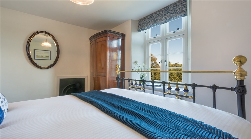 The first-floor double bedroom at Compass Cottage in Dartmouth, Devon
