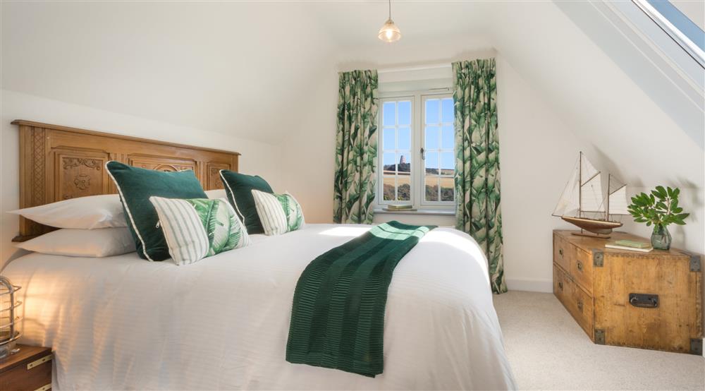 The master bedroom at Compass Cottage in Dartmouth, Devon