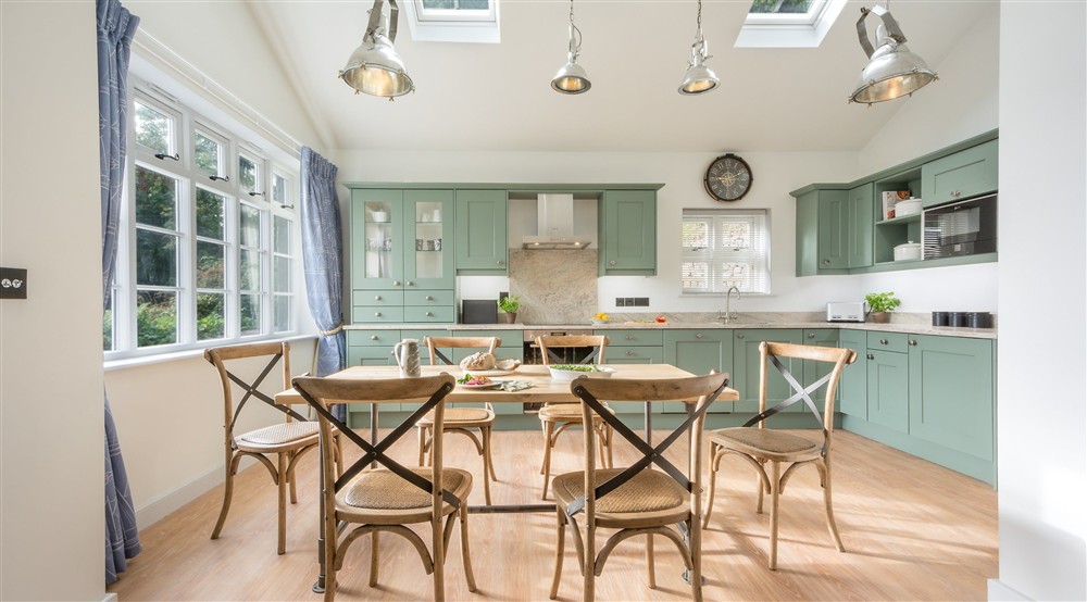 The open-plan kitchen and dining room (photo 2) at Compass Cottage in Dartmouth, Devon