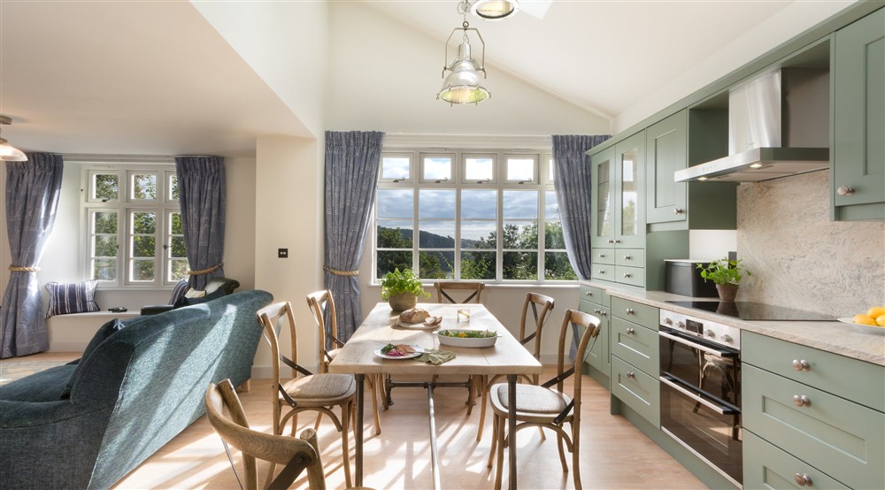 The open-plan kitchen, dining and sitting room (photo 2) at Compass Cottage in Dartmouth, Devon