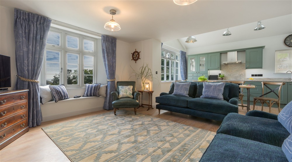 The open-plan kitchen, dining and sitting room (photo 3) at Compass Cottage in Dartmouth, Devon