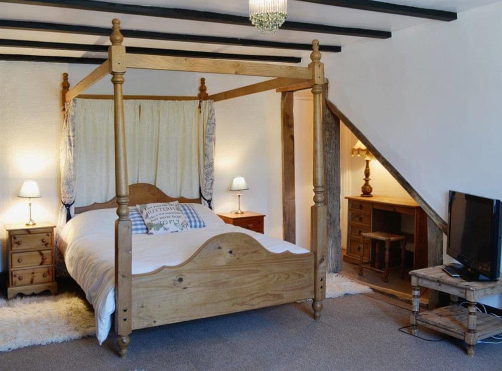 Four Poster bedroom at Conifers in Bish Mill, near South Molton, Devon