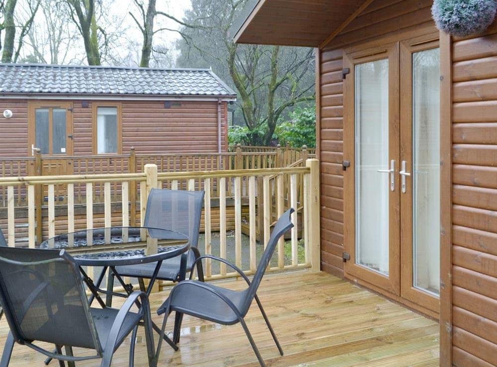 Raised decking with outdoor furniture at Coniston 5 in Troutbeck Bridge, near Windermere, Cumbria
