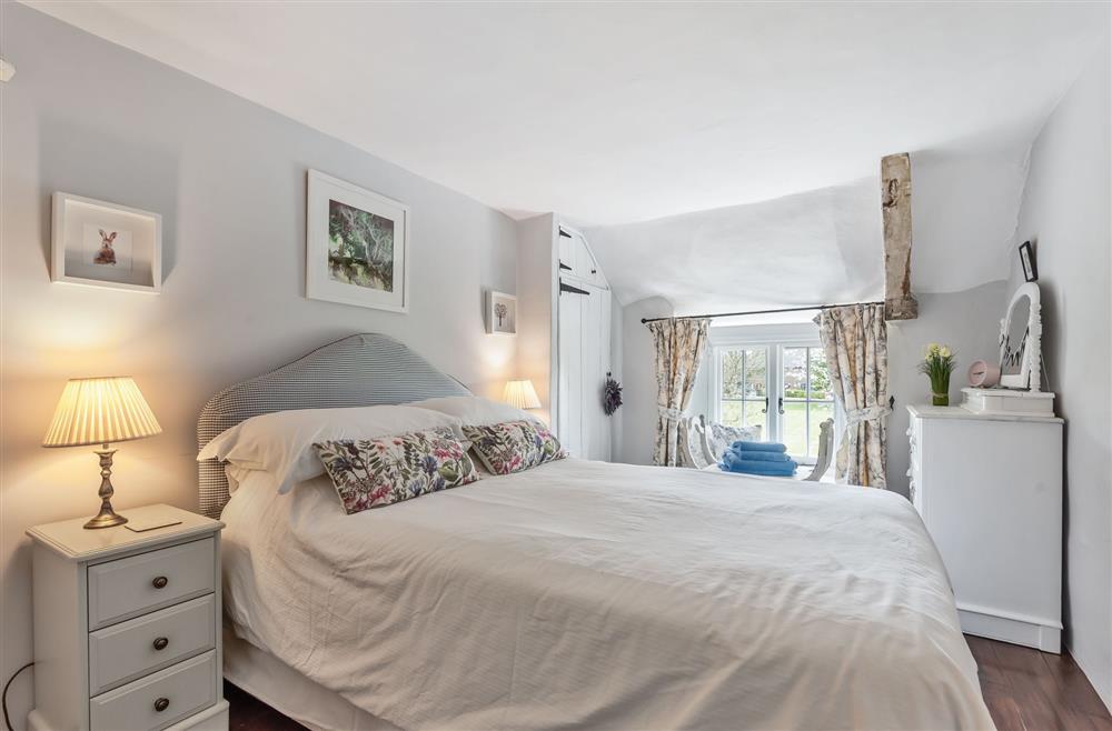 Bedroom two with a double bed at Coombe Cottage, Dorchester