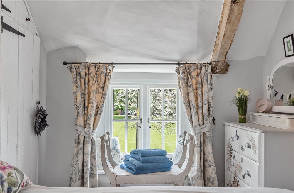 Bedroom two with a view at Coombe Cottage, Dorchester