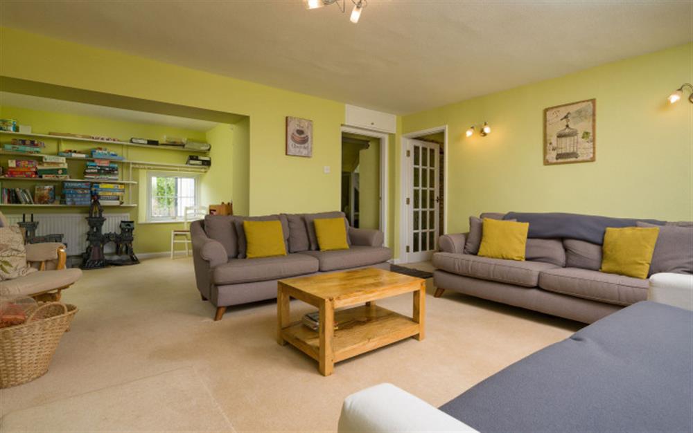 The living room has a cosy logburner at Coombe Park in Chillington