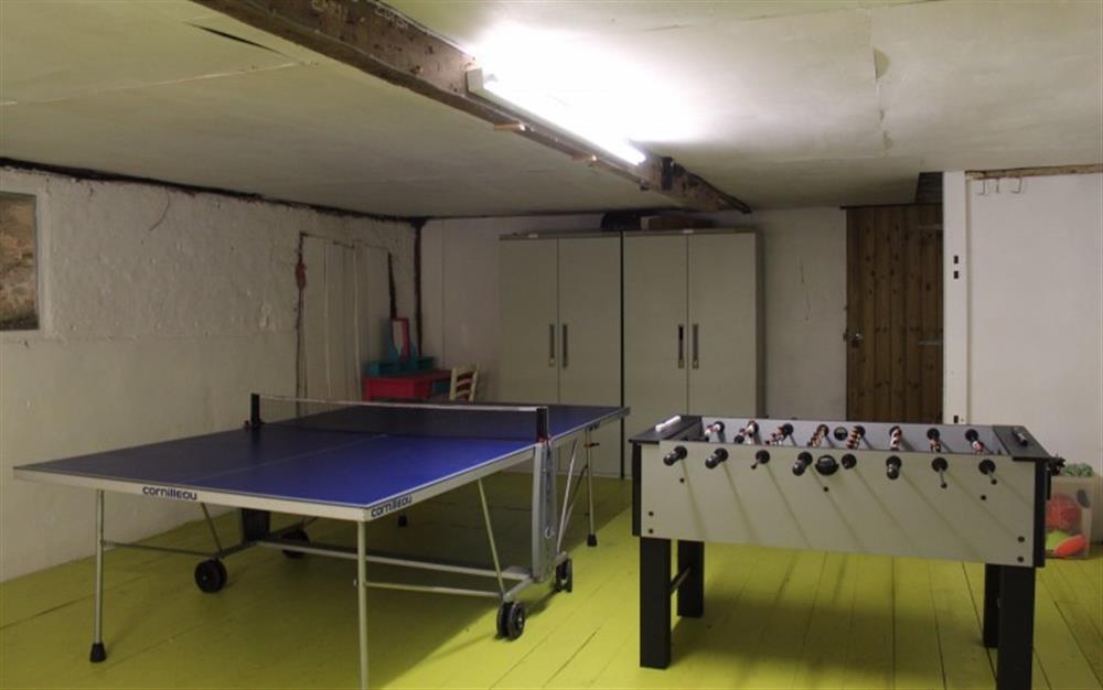 The lower barn accessed from the kitchen houses a table tennis and table football table at Coombe Park in Chillington