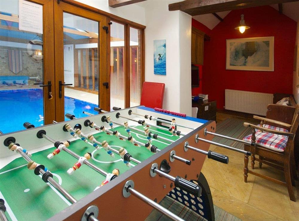 Games room overlooking the swimming pool at Coombehayes Barn in Uplyme, Nr Lyme Regis., Dorset