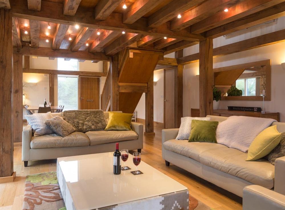Cosy lounge area with wood beams at Coot Lodge in Somerford Keynes, near Cirencester, Gloucestershire
