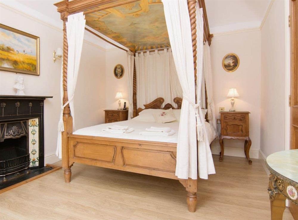 Impressive four poster bedroom with its own en-suite bathroom at Copper Beech Cottage  in Aberaeron, Ceredigion., Dyfed
