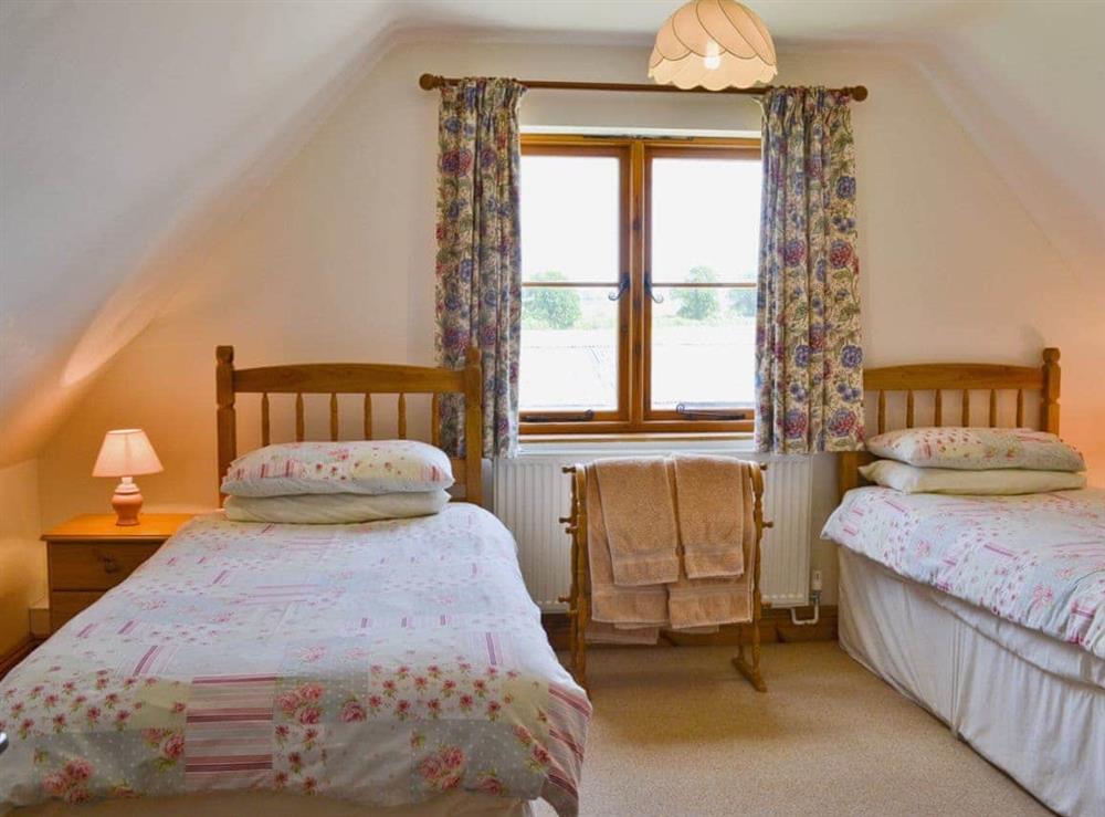 Twin bedroom at Copper Cottage in Aldeby, near Beccles, Norfolk
