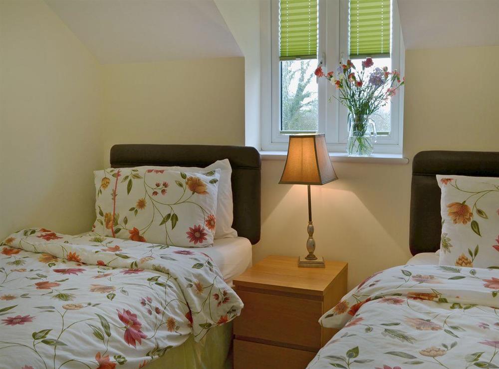 Charming twin bedroom at Birch Lodge, 