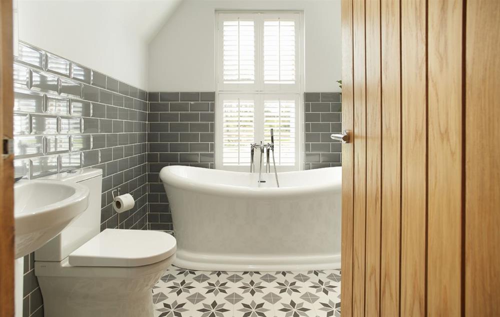 Bathroom with roll top bath and walk-in shower at Coppet Hall Lodge, Saundersfoot
