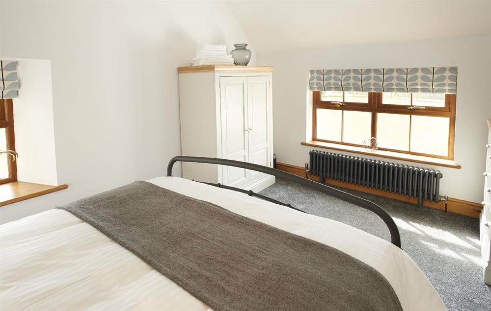 Bedroom with 5’ king-size bed (photo 2) at Coppet Hall Lodge, Saundersfoot