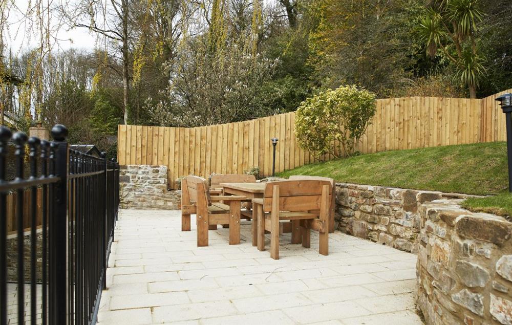  Secluded courtyard and raised patio area with garden furniture at Coppet Hall Lodge, Saundersfoot