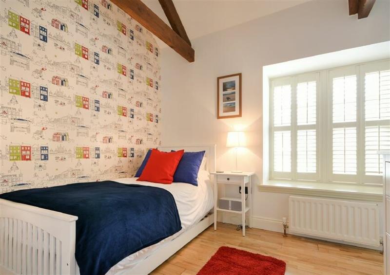 A bedroom in Coral Cottage at Coral Cottage, Bamburgh
