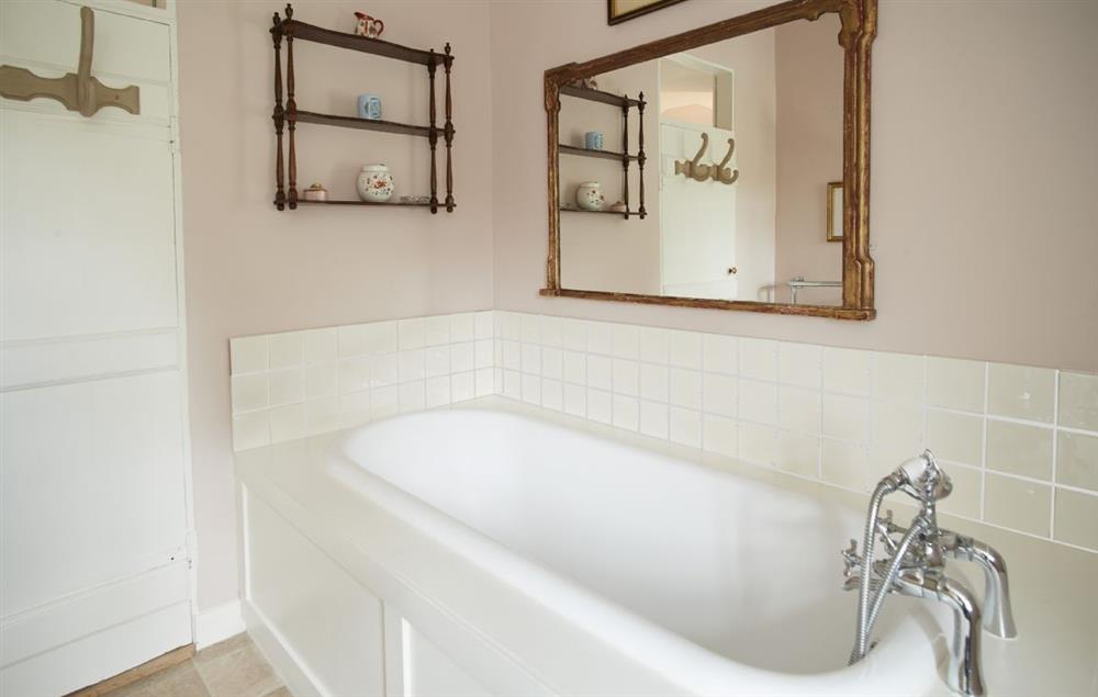 Bathroom with bath and shower adjustment at Coral Cottage, Castle Howard