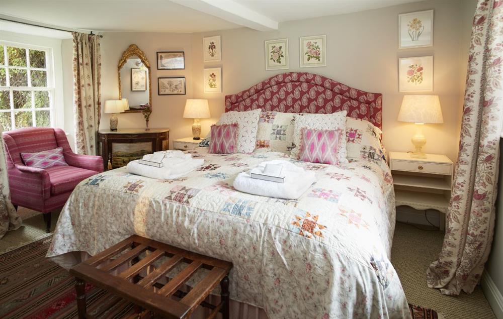 Master bedroom with super king bed and en-suite bathroom at Coral Cottage, Castle Howard