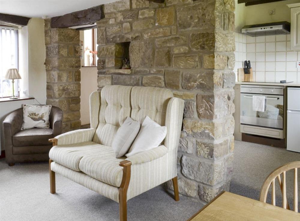 Comfy living area with open aspect to kitchen at Corby Wood in Rosedale, near Pickering, North Yorkshire