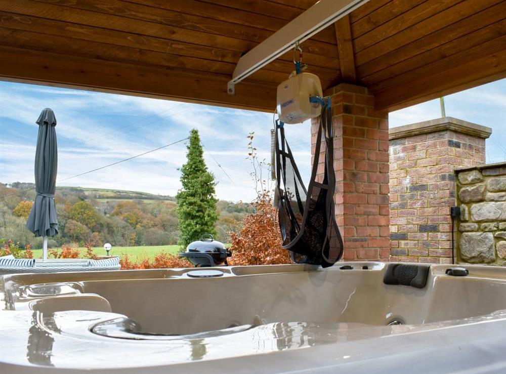 Hot tub with track hoist at Coria Lodge in Ebchester, Northumberland