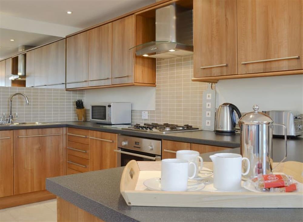 Well-equipped kitchen area with an adjoining dining space at Corn Meadow in Near Kirkby Lonsdale, Lancashire