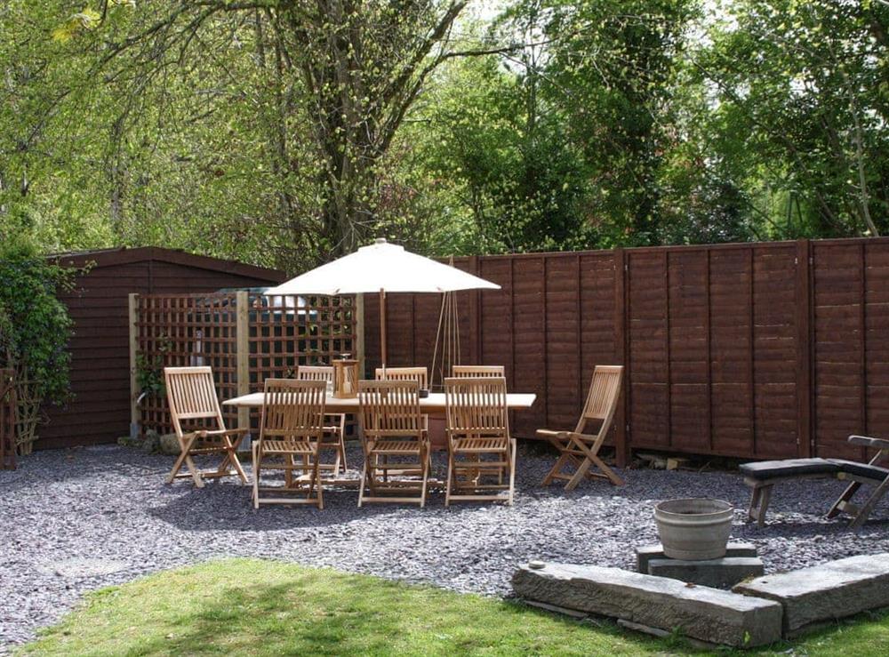 Gravelled patio area with outdoor furniture at Cornant in Llechryd, near Cardigan, Dyfed