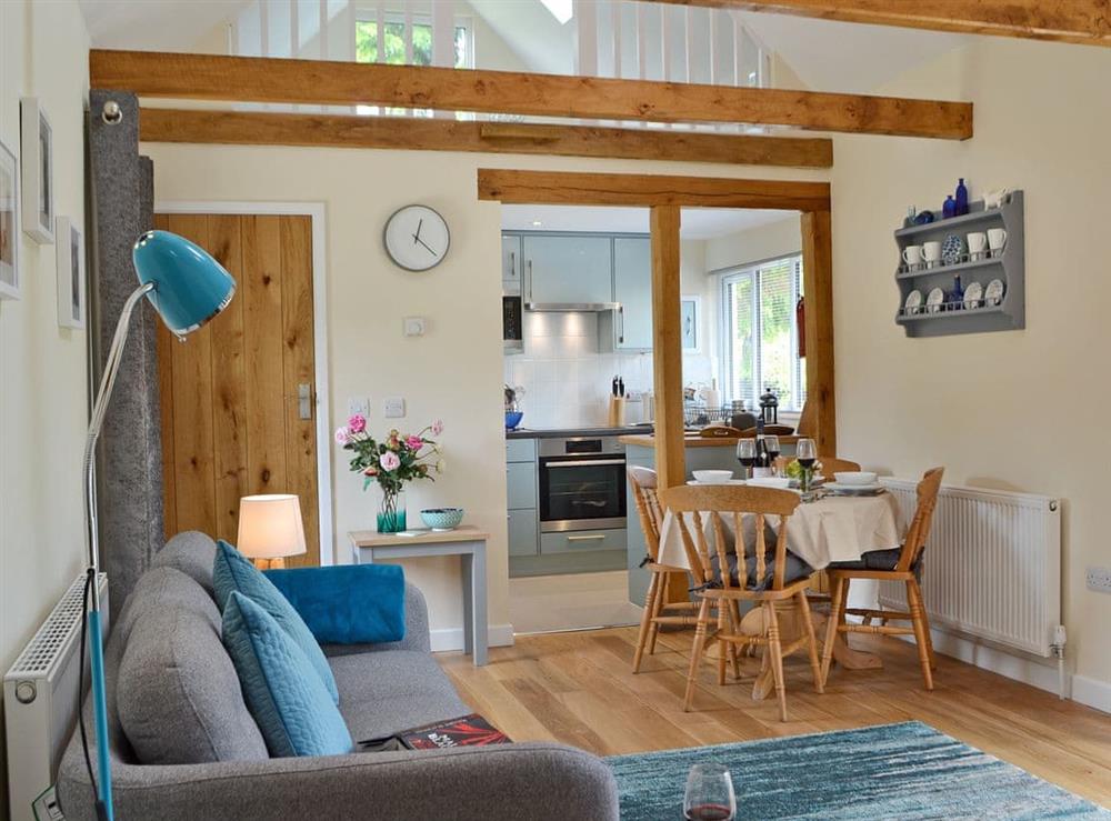 Beautifully presented open plan living space with beams (photo 2) at Cornbrash Farm Cottage in Earlsdown, near Heathfield, Sussex, East Sussex