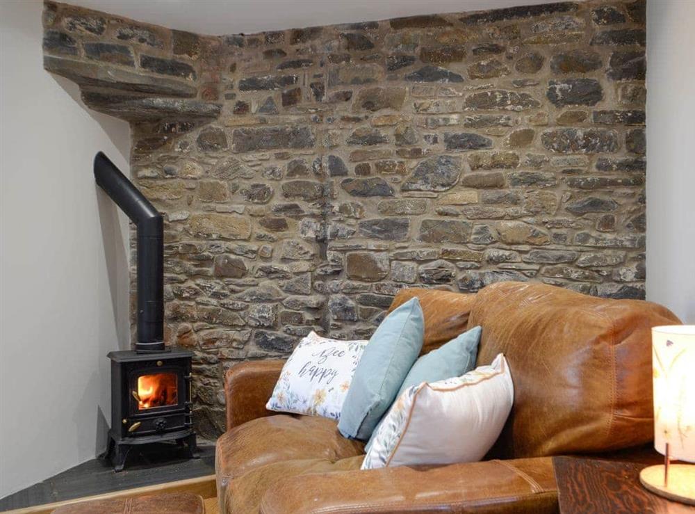 Cosy living area with wood burner at Cornel Clyd in Felinfach, near Lampeter, Ceredigion, Dyfed