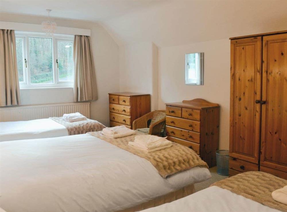 Double bedroom with 2 additional single beds at Corner Cottage in Troutbeck Bridge, near Windemere, Cumbria., Great Britain