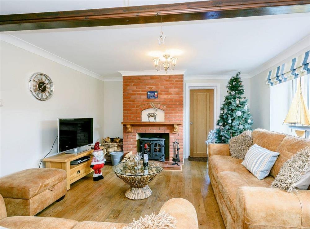 Beautifully presented living room with wood burner at Corner House in East Runton, Norfolk