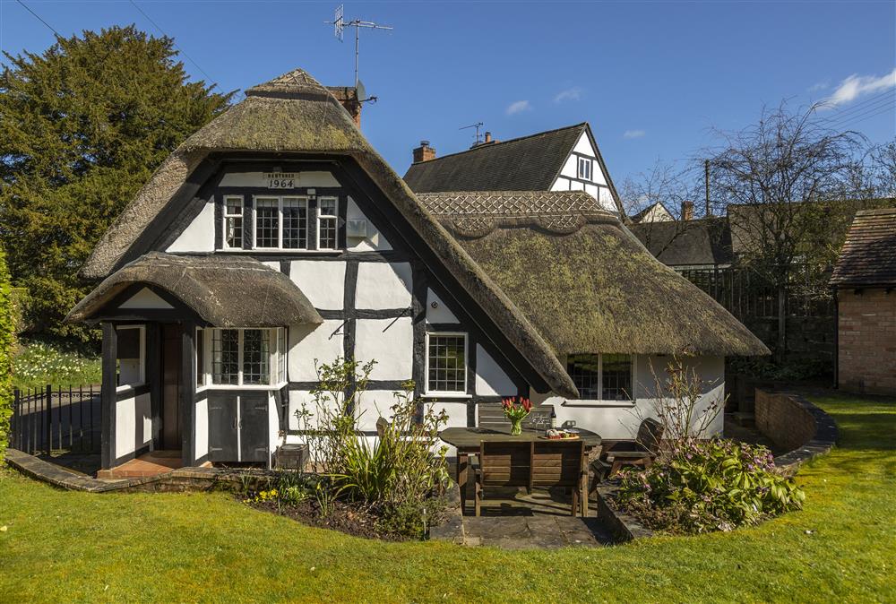A ’chocolate box’ thatched 19th century cottage at Corner Thatch, Abbots Morton