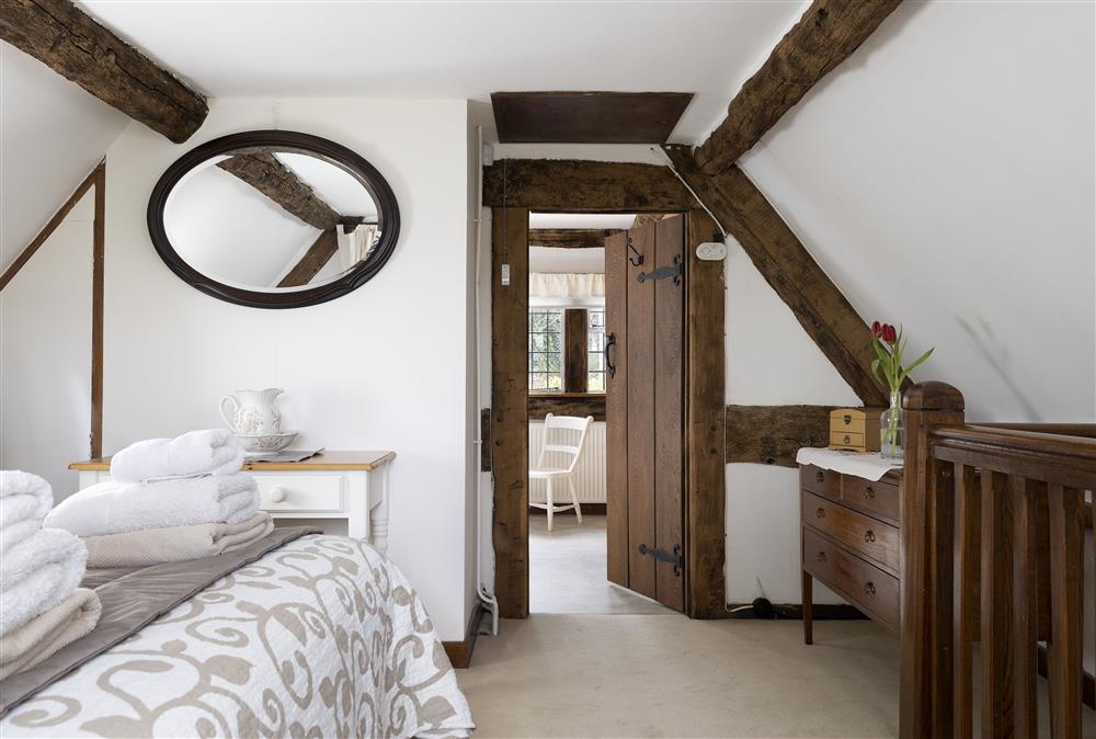 Stairs lead up into the master suite at Corner Thatch, Abbots Morton